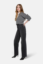 lkblue high rise straight leg jeans in charcoal style with grey top by a model 