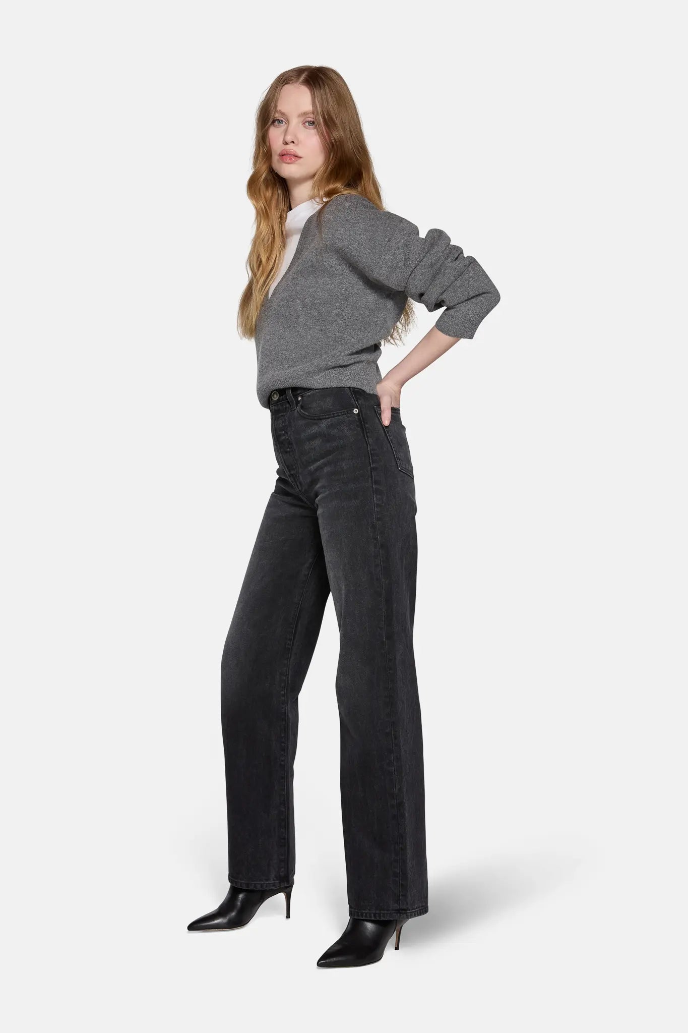 lkblue high rise straight leg jeans in charcoal style with grey top by a model 