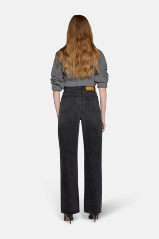 model wearing high rise straight leg jeans in charcoal 
