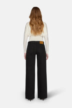 low rise baggy jeans for women worn by model.