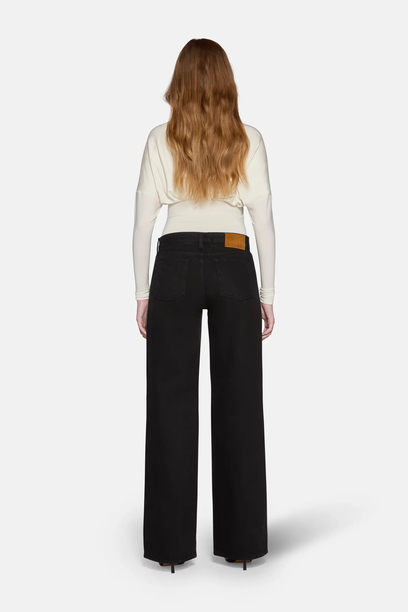 low rise baggy jeans for women worn by model.