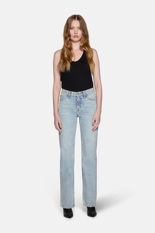 women wearing black top and light blue bootcut jeans for women 