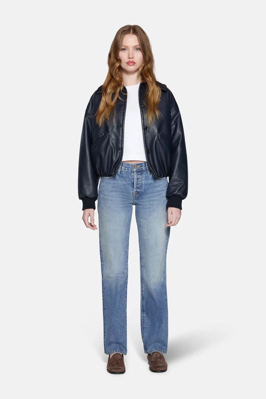 light wash straight leg jeans with black jacket and white top 
