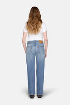 light wash straight leg jeans, back cover with blonde hair 