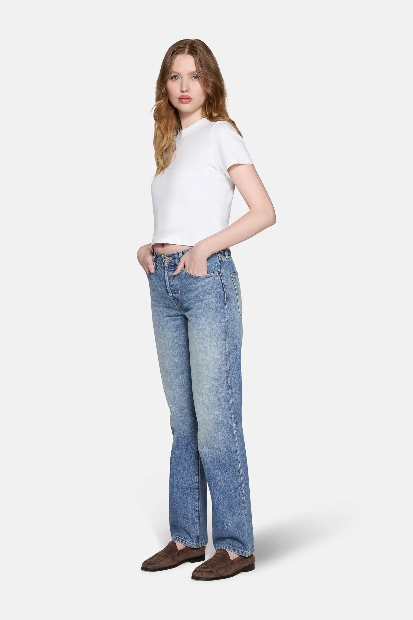 women wearing white top and light wash straight leg jeans for women by LKBLUE 