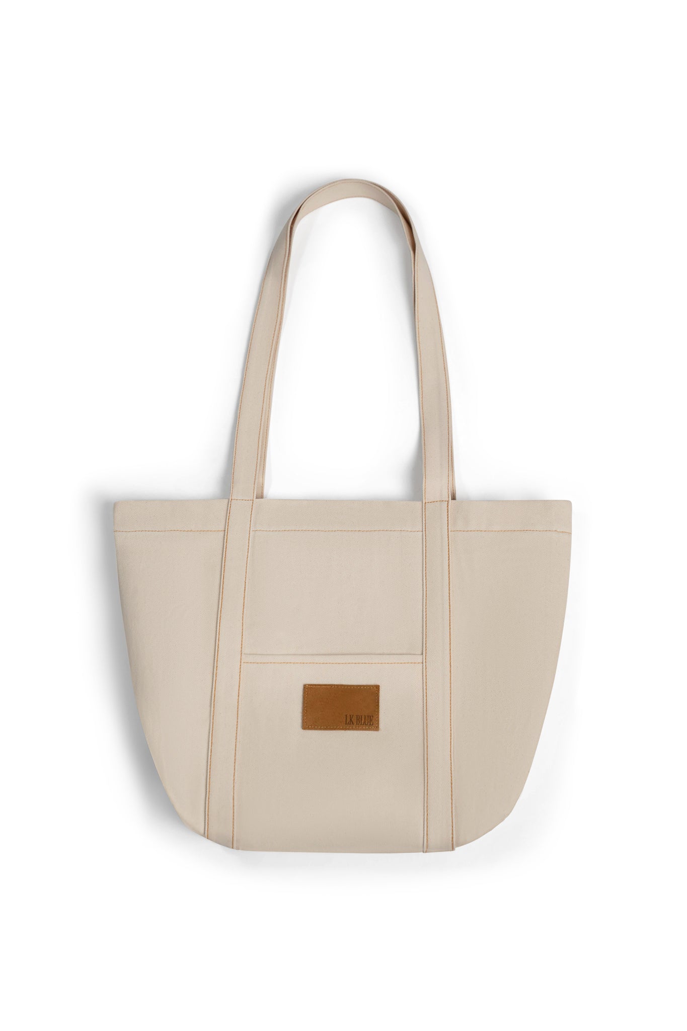 Beige tote bag with a brown leather patch on a white background