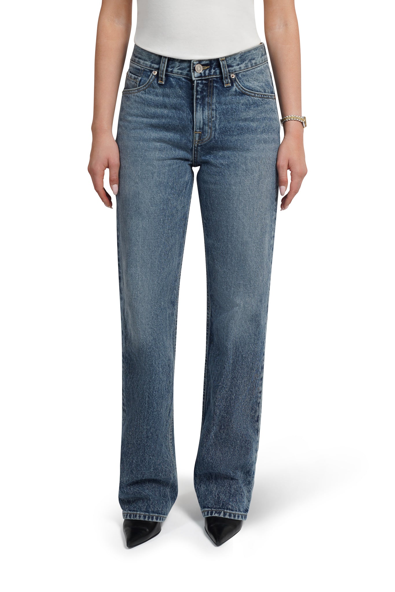 Blue jeans worn by a person on a white background