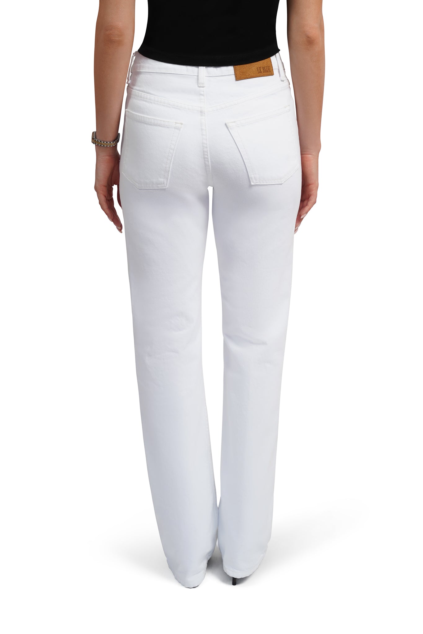 White pants worn by a person on a white background