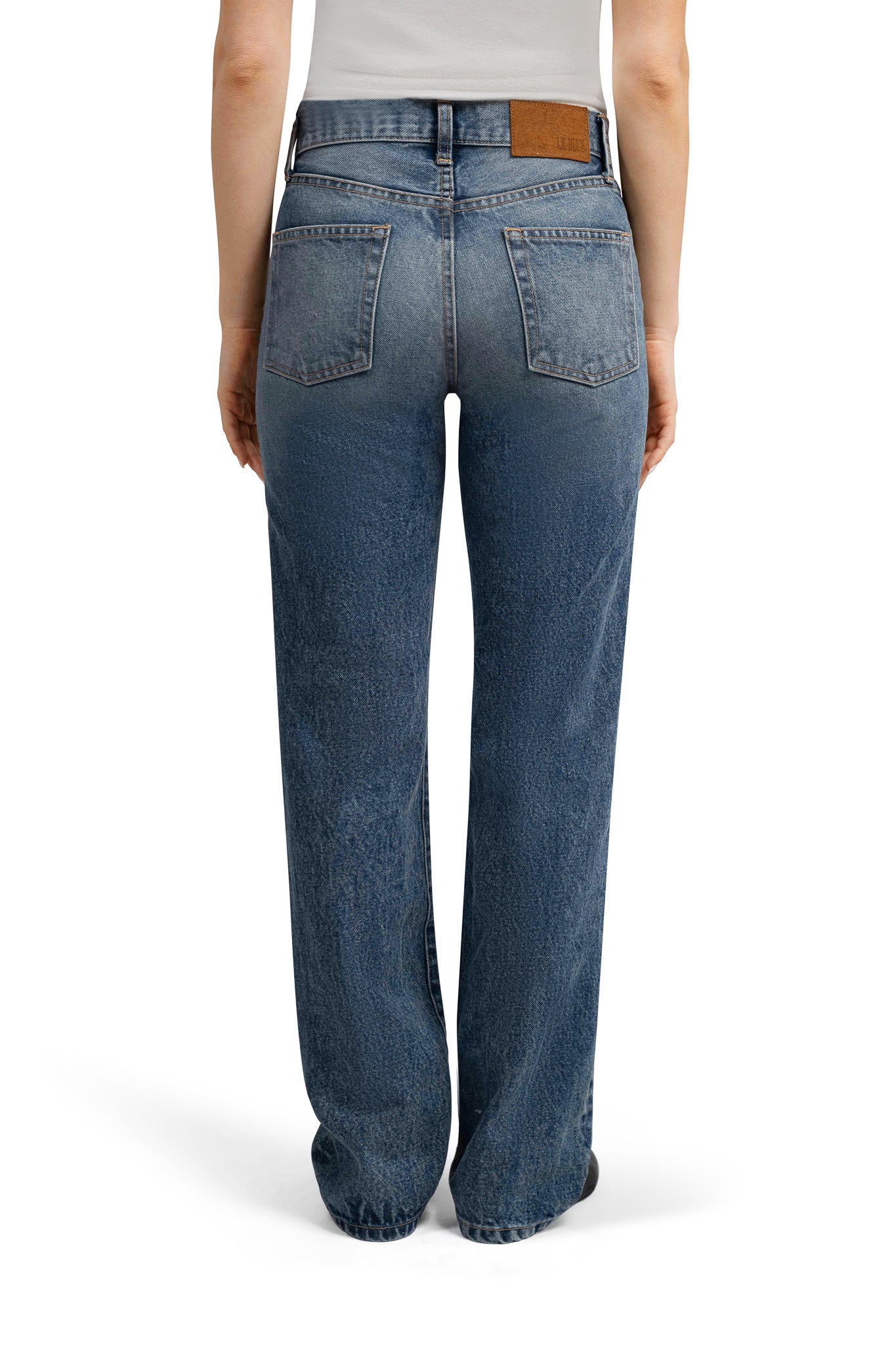 Blue  LA denim jeans worn by a person on a white background