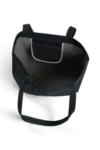 Black leather seat cover with straps on a white background