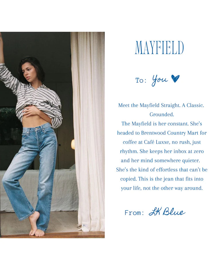 Person wearing blue jeans and a striped shirt in a room with text about Mayfield jeans.