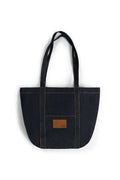 Black tote bag with a brown patch on a white background