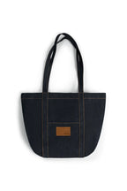 Black tote bag with a brown patch on a white background