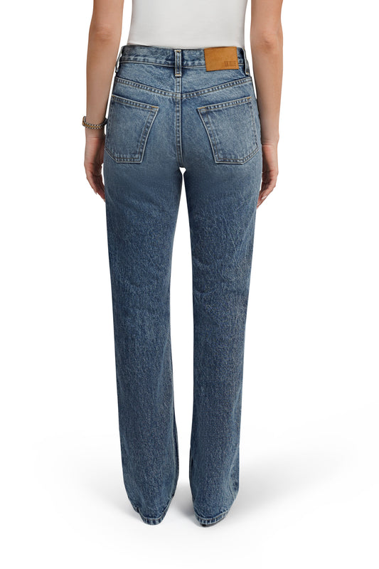 Blue jeans worn by a person on a white background